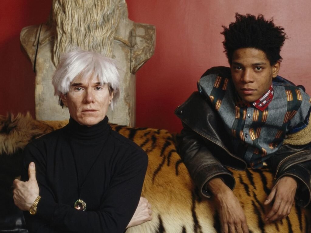 Andy Warhol y Jean-Michel Basquiat, retratados en 1985.